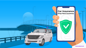 The image depicts a hand holding a smartphone against a vibrant blue background. On the smartphone screen, the words "Car Insurance" and "King Fahd Causeway" are prominently displayed, accompanied by a green shield with a checkmark inside. The shield symbolizes protection and insurance coverage, particularly when crossing international borders. In the background, a white SUV is driving across a bridge. This bridge is the King Fahd Causeway, connecting Saudi Arabia and Bahrain.